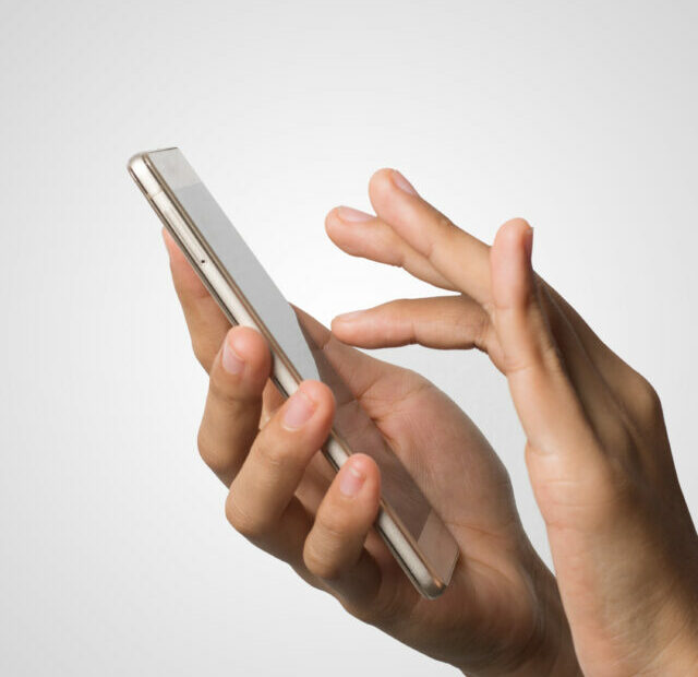 cropped-woman-hand-holding-smart-phone-blank-screen-copy-space-hand-holding-smartphone-isolated-white-background.jpg